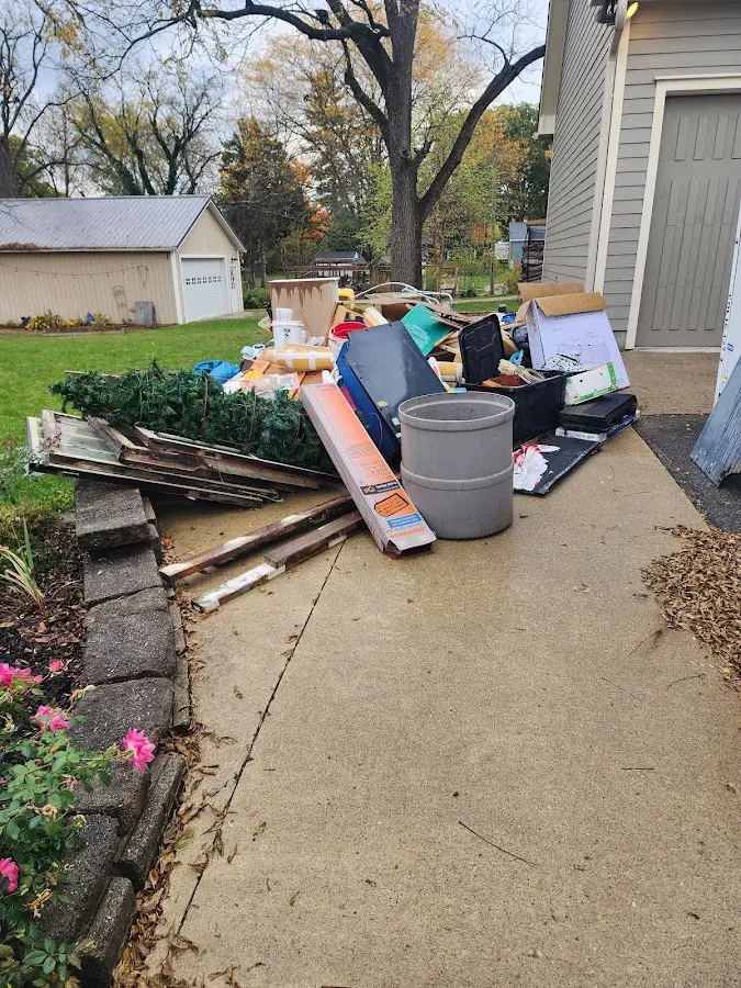 Dumpster being loaded with debris for Commercial Dumpster Rental in Lexington